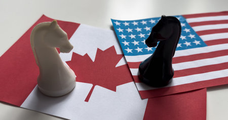 Chess pieces on the background of the American flag and Canadian flag. Election concept