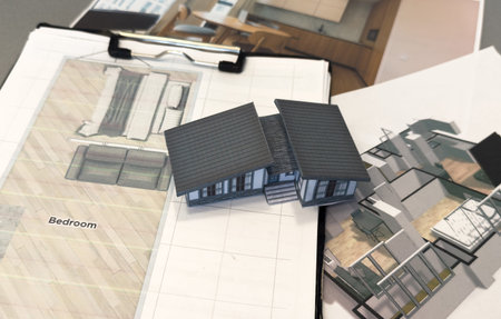 Architectural engineering design plan drawing on the table. Architects work on table in studio....