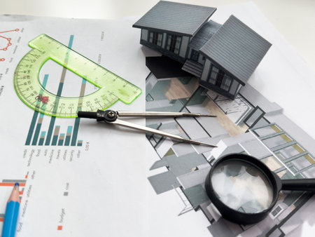 Architectural engineering design plan drawing on the table. Architects work on table in studio. Construction design and planの写真素材