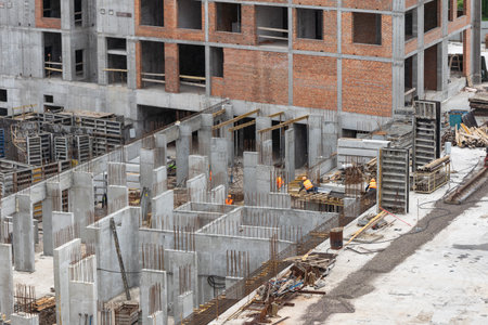 Construction of apartment buildings, dense urban development. The process of construction of residential buildings.の写真素材