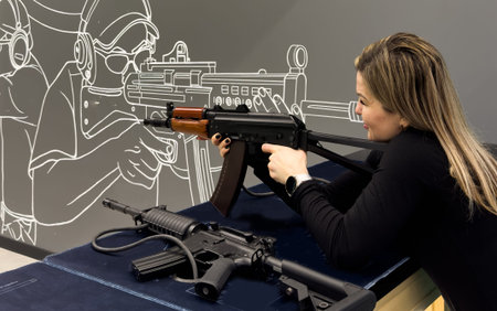 Woman with a rifle at a shooting range near the target. High quality photo