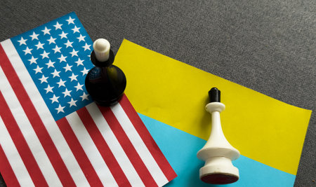 Chess pieces on the flags of the United States and Ukraineの写真素材