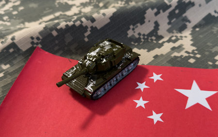 Toy tank with China flag on green backgroundの写真素材