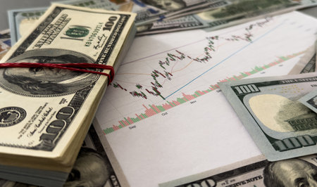 100 USA dollars banknote over stock market chartの写真素材