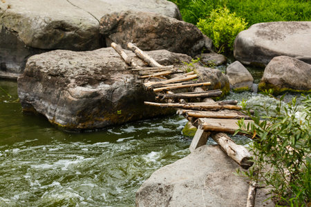 beautiful ripples on river flow over stones in summerの写真素材