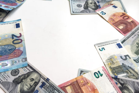 Banknotes of 100 dollar Banknotes of 100 euros Background of cash dollar and euro bills. American currency European currency United States Cash banknotes Financial Money background concept.の写真素材