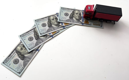 toy truck lie on dollars, space for text.