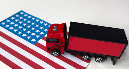 US flag in the background. Truck, transport, freight transport. Freight and logistics conceptの写真素材