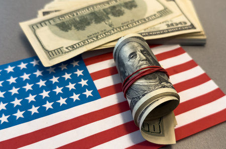 American money. World economic crisis. Currency exchange. Fed. 100 dollars on the American flag.