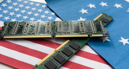 Flag of the USA on semiconductor chip or microchip on a motherboardの写真素材