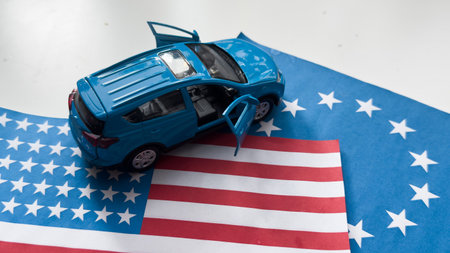 toy car and flags of the USA and the European Unionの写真素材