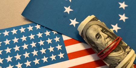 American flag on hundred dollar bill background. Money, cash background. Financial concept. Vintage, retro look.の写真素材