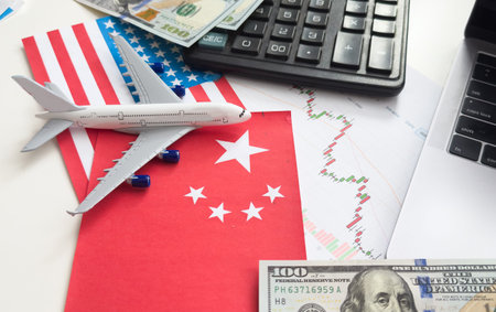 USA and China flag on coins stacking, Concept of Recession conflict tax business finance money, Symbol of economic tariffs trade war and tax barrier between United States of America and China.の写真素材