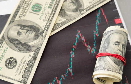 US dollar on the background of the financial chart. Concept Economy, business investment, economic crisis, decline in profits, recession. mixed mediaの写真素材