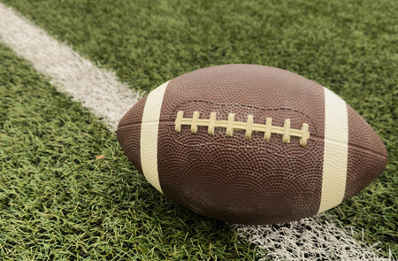 American football on football field backgroundの写真素材