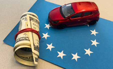 Car on the dollar money and flag of the European Unionの写真素材
