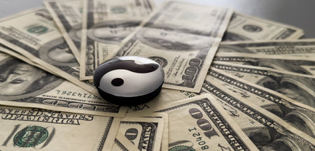 shot of a yin-yang symbol on banknotes.の写真素材