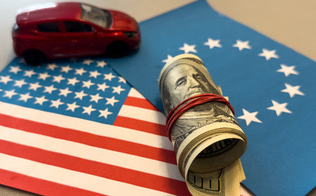 Car on the dollar money and usa flag and the flag of the European Unionの写真素材