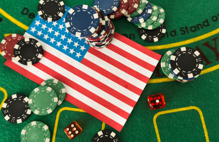 Chips from casino. USA flag. Gambling industry in united states. Casino chips are scattered on steel. Gambling business in las Vegas concept. Casinos in US. Gambling in USA. Poker, rouletteの写真素材