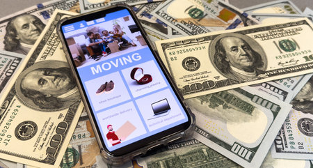 smartphone and home mortgage loan repayment plan. dollarsの写真素材