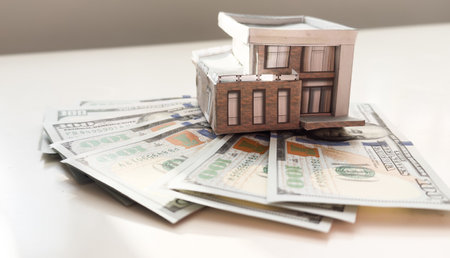 paper toy house and dollars.の写真素材