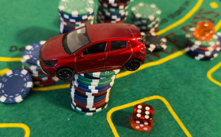 pile of casino chips and toy car,の写真素材