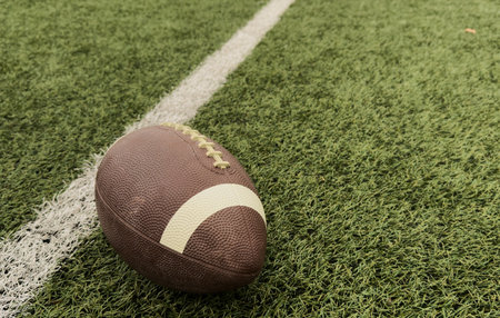 American football on football field backgroundの写真素材