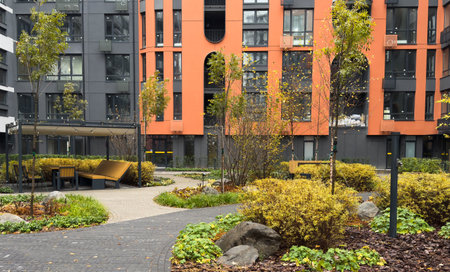 Residential area with ecological and sustainable green residential buildings, low-energy houses with apartments and green courtyardの写真素材