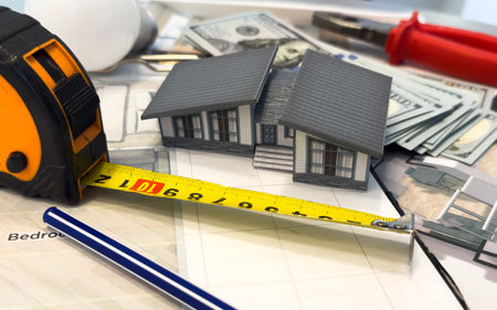 Architectural engineering design plan drawing on the table. Architects work on table in studio. Construction design and planの写真素材