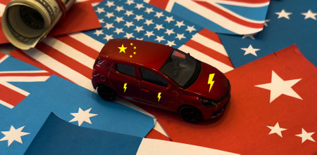 China and United States of America trade competition. United States of America and China flags with American dollars and electric car from Chinaの写真素材