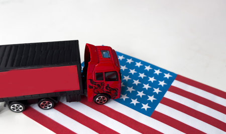 US flag in the background. Truck, transport, freight transport. Freight and logistics conceptの写真素材