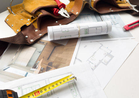 Architectural engineering design plan drawing on the table. Architects work on table in studio. Construction design and planの写真素材