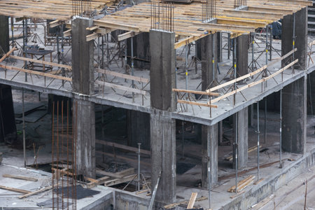 Construction crane on Housing. Construction site with buildings under construction. Tower cranes in action. Crane during formworks. Multi Storey Residential Buildings construction, aerial view.の写真素材