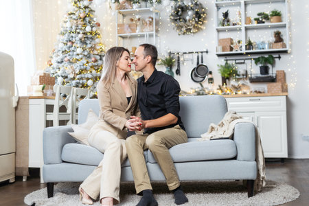 A happy couple shares a joyful moment at home.の写真素材
