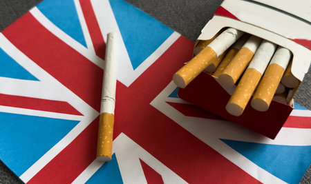 UK flag with cigarette isolated on black backgroundの写真素材