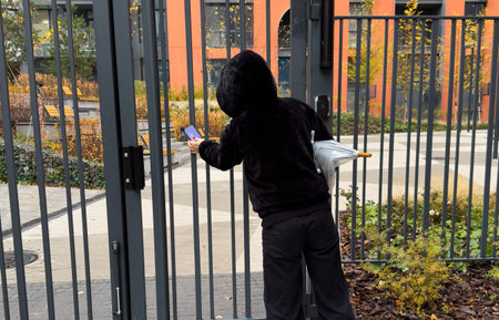 a female entering the garden through a gateの写真素材