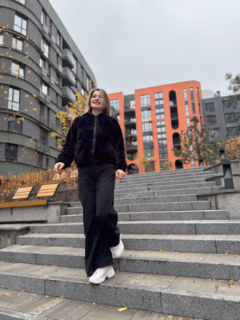 Smiling Woman Outdoor Portrait. blonde hair fashion model wears stylish clothes. Fashion trend of autumnの写真素材