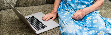 Senior woman remote work. c sitting at a laptop at home. aging, employee, self-employedの写真素材