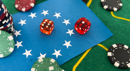 Dice, chess pieces, playing cards, wooden checkers and dominoes for board games on a light table. flag of the European Unionの写真素材