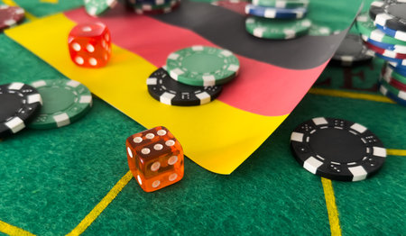 Chips from casino. germany flag. Gambling industry in germany. Casino chips are scattered on steel. Gambling business. Casinos. Gambling. Poker, roulette.の写真素材