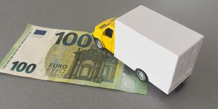 The truck on euro bills. Concept of an insurance contract for new trucks or expensive fuelの写真素材