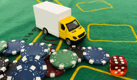 a toy truck with a poker chipの写真素材