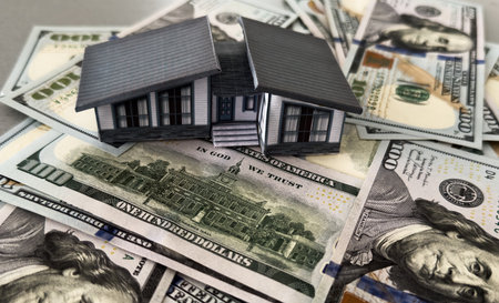 Real estate loan concept; House on dollarsの写真素材