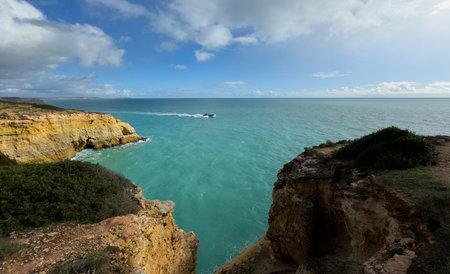 Beautiful natural limestone arch near Praia da Marinha in Lagoa, Portugal