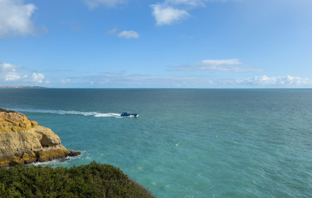 Coast cliff island sea ocean shipの写真素材