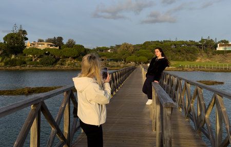 Sea beach white sand with wooden bridge against sky