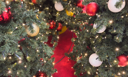 Decorated christmas tree with colorful ornaments indoors