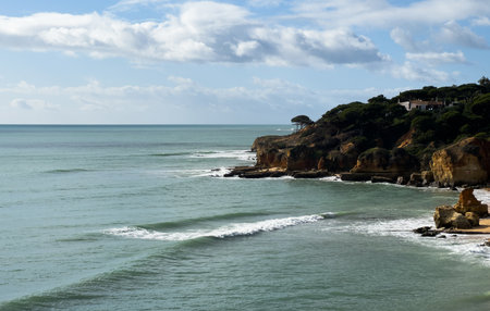 View of the sea and rocks of the beach of Olhos de Agua, Albufeira, Algarve, Portugal.の写真素材