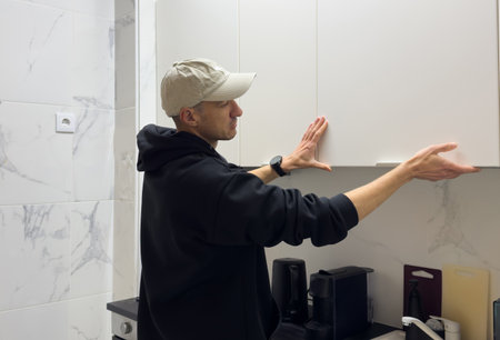 man working on a new kitchen installationの写真素材