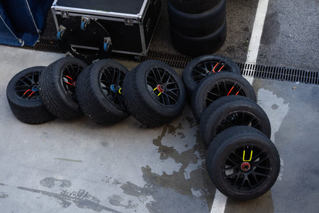 Detail of a stack of tires with tires for racing cars, they are in the back of the team truckの写真素材